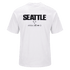 The back of a white t-shirt featuring "SEATTLE" in large black letters above smaller brand logos, including Nike Soccer.