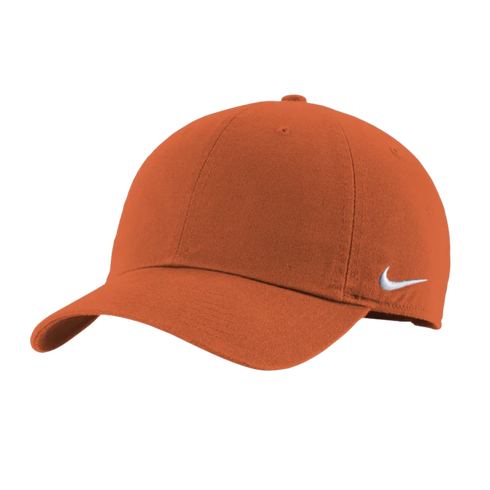 A solid burnt orange Nike baseball cap with a white swoosh logo on the side, shown at a three-quarter angle against a white background.
