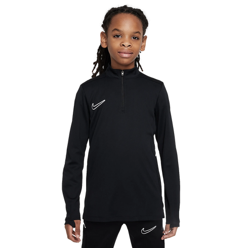 A youth in a black Nike long-sleeved quarter-zip athletic top and matching pants against a plain white background.