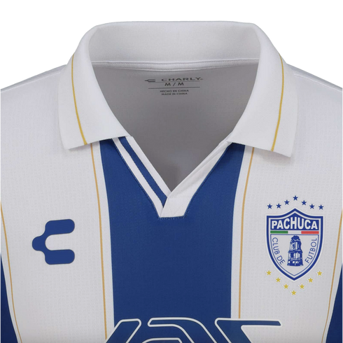 Close-up of a white and blue striped Pachuca soccer jersey with a white polo collar, featuring the Charly logo and club crest.