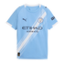 Sky blue Manchester City soccer jersey with a white diagonal sash, dark blue Puma and Etihad logos, and the club crest. Short-sleeved with white trim.