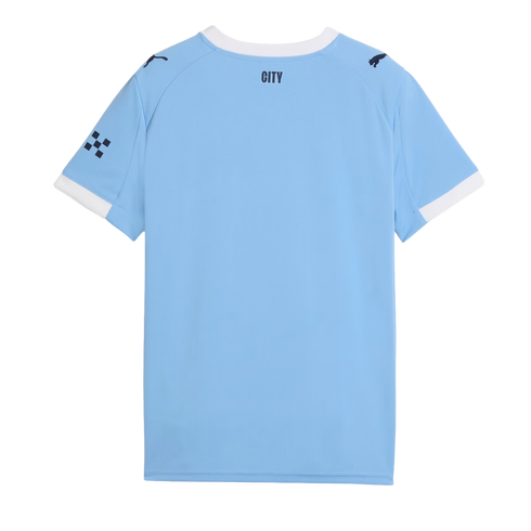 A back view of a light blue soccer jersey with white trim on the collar and sleeves. It features black 'CITY' text on the neck and Puma logos on the shoulders.