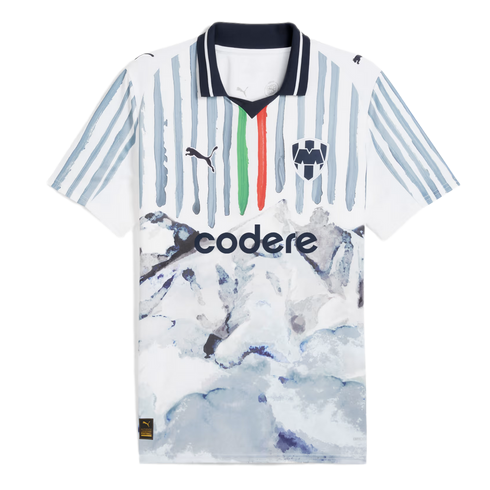 White Puma Monterrey soccer jersey featuring grey brushstroke stripes, green and red accents, and a watercolor mountain landscape graphic on the bottom half.