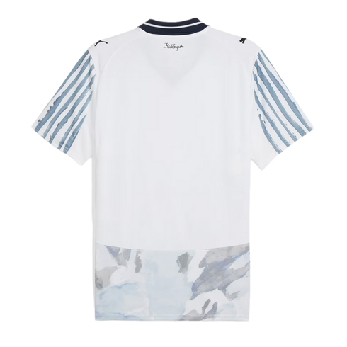Back of a white sports jersey with blue-striped sleeves, a navy collar, and an abstract grey-blue watercolor design across the bottom hem.