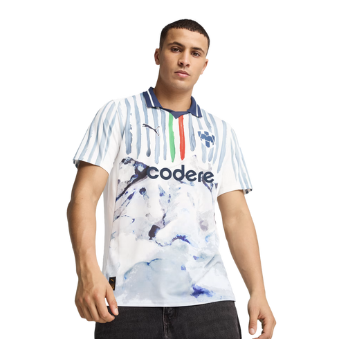 A man models a white soccer jersey with blue stripes and a marbled pattern, featuring the "codere" sponsor logo and a blue collar, set against a plain white background.