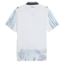 The back of a white short-sleeved jersey with blue brushstroke sleeves, an abstract watercolor hem, and "KidSuper" branding at the neck.