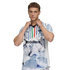 A man modeling a white soccer jersey featuring blue, green, and red vertical stripes and a large blue and white watercolor graphic on the lower half.