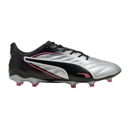 Side profile of a Puma soccer cleat in metallic silver and black with pink accents and pink-tipped studs, set against a solid black background.