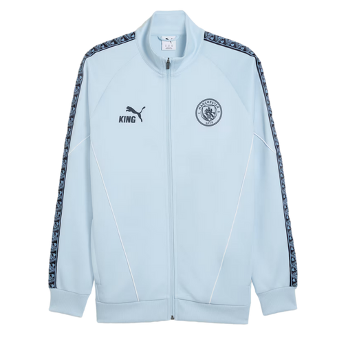 Light blue Puma King zip-up jacket featuring the Manchester City FC crest, patterned sleeve trim, and white piping accents.