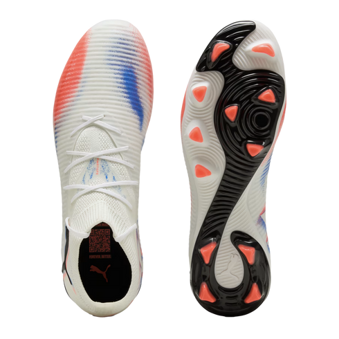 Top and soleplate views of a white Puma soccer cleat with red and blue graphics and orange studs against a black background.