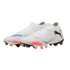 A pair of white Puma soccer cleats with red and blue graphic accents and a black logo, shown against a black background.