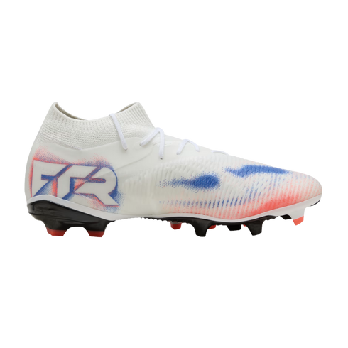 A white Puma soccer cleat with red and blue accents, featuring "FTR" branding on the heel and a black soleplate, displayed against a solid black background.