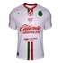 A white Puma soccer jersey for Chivas (C.D. Guadalajara) featuring a red collar, vertical green and red stripes, and sponsors MG, Amazon Prime, Caliente, and Mercado Pago.
