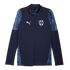 Navy blue Puma full-zip soccer jacket for C.F. Monterrey with white logos and light blue patterned panels on the shoulders and sides.