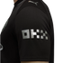 Close-up of a black jersey sleeve with a silver blocky "OKX" logo and a silver Puma logo on the shoulder.