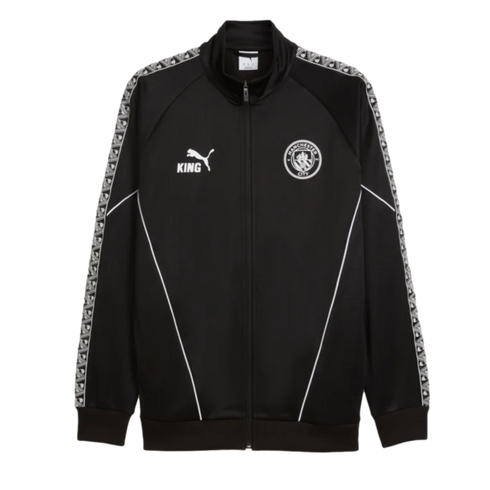 A black Puma Manchester City track jacket with 'KING' and team logos. It features white piping on the front and patterned tape along the shoulders and sleeves.