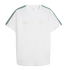 White Puma T-shirt featuring faint gold "KING" and AC Milan logos on the chest, with green and white patterned tape along the shoulders and sleeves.