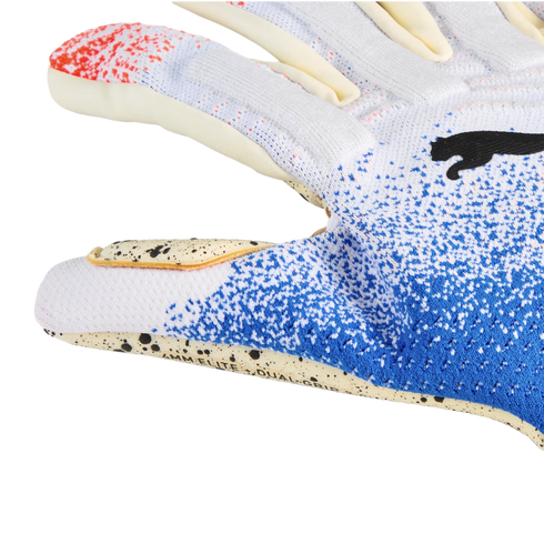 Close-up of a Puma goalkeeper glove with a white and blue speckled knit backhand and a cream-colored palm with black speckles and "4MM ELITE + DUAL GRIP" text.