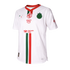 White Chivas soccer jersey featuring green and red vertical stripes and logos for MG, Amazon Prime, Mercado Pago, and Puma. Red V-neck collar.