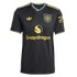 A black Manchester United soccer jersey with yellow Adidas and Snapdragon logos, a club crest, and blue and yellow trim on the collar and sleeves.