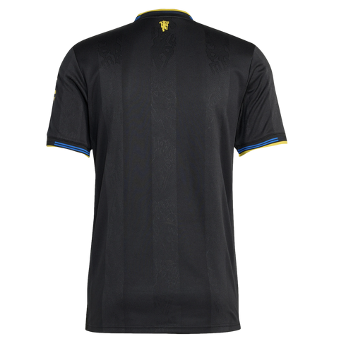 Back view of a black soccer jersey with yellow and blue trim on the collar and sleeves. It features subtle tonal patterns and a small yellow crest at the nape of the neck.