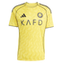 A yellow Al-Nassr FC soccer jersey by Adidas with a subtle tone-on-tone wavy pattern, black KAFD sponsor logo, and dark piping along the shoulders and sleeves.
