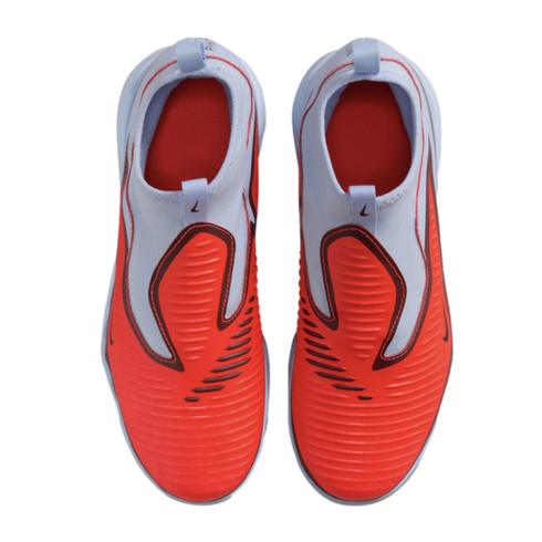 Top-down view of a pair of Nike slip-on athletic shoes featuring a bright orange ribbed forefoot and light blue knit collar.