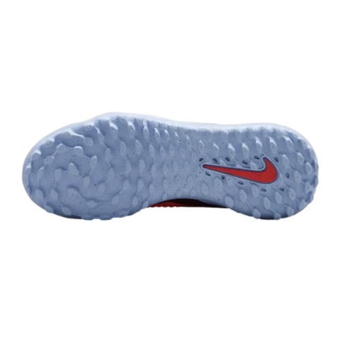 Sole of a light blue Nike athletic shoe featuring a pebbled traction pattern and a red swoosh logo on the heel.