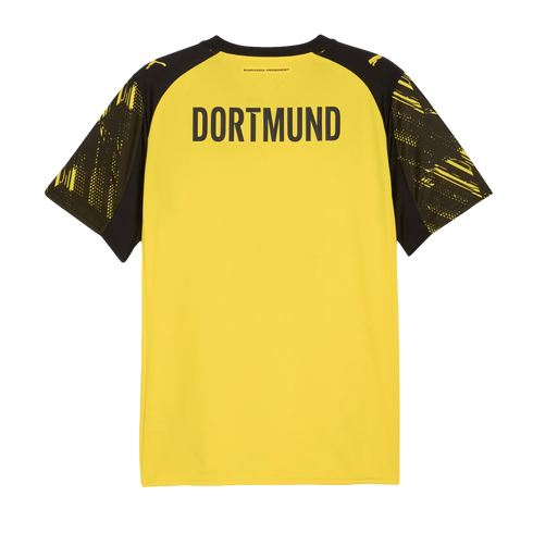 Back of a yellow football jersey with "DORTMUND" in bold black text across the shoulders and patterned black sleeves.