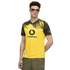 A man wearing a yellow and black Borussia Dortmund soccer jersey with a Vodafone logo, sunglasses, and olive shorts.