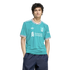 A man wearing a turquoise Liverpool FC jersey and dark blue shorts, standing against a black background.