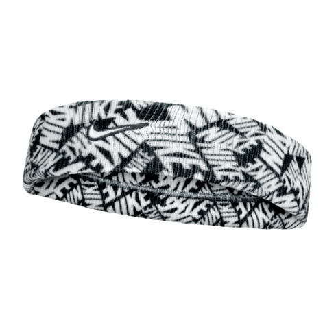 A black and white Nike headband featuring an all-over repeating "NIKE" logo print and a small black embroidered swoosh on the front center.