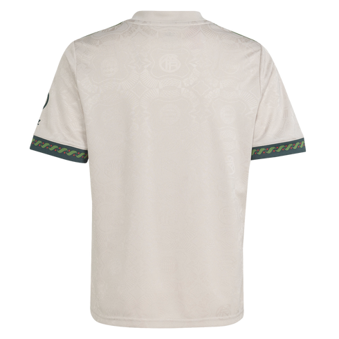 Rear view of an off-white jersey with a subtle tonal pattern and decorative dark green sleeve cuffs featuring red and light green details.