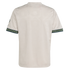 Rear view of an off-white jersey with a subtle tonal pattern and decorative dark green sleeve cuffs featuring red and light green details.