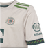 Close-up of a white FC Bayern Munich soccer jersey featuring an intricate woven pattern, vintage-style crest, green shoulder stripes, and Allianz sleeve logo.