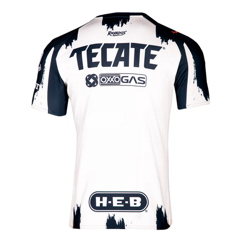 Back view of a white Rayados soccer jersey with navy brushstroke patterns and navy blue sponsor logos for Tecate, Oxxo Gas, and H-E-B.
