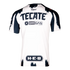Back view of a white Rayados soccer jersey with navy brushstroke patterns and navy blue sponsor logos for Tecate, Oxxo Gas, and H-E-B.