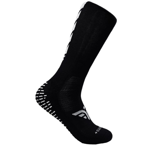 Black crew-length athletic grip sock featuring white nonslip heel pads and a white logo on the arch, shown against a solid black background.