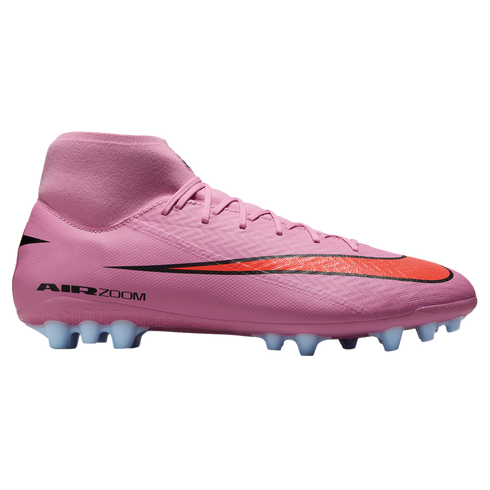 Side view of a pink high-top Nike soccer cleat with a red swoosh and light blue studs on a black background.