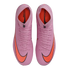 Top-down view of pink Nike Mercurial high-top soccer cleats with bright orange Nike swoosh logos on a black background.