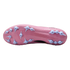 Bottom view of a pink soccer cleat with light blue plastic studs on a black background.