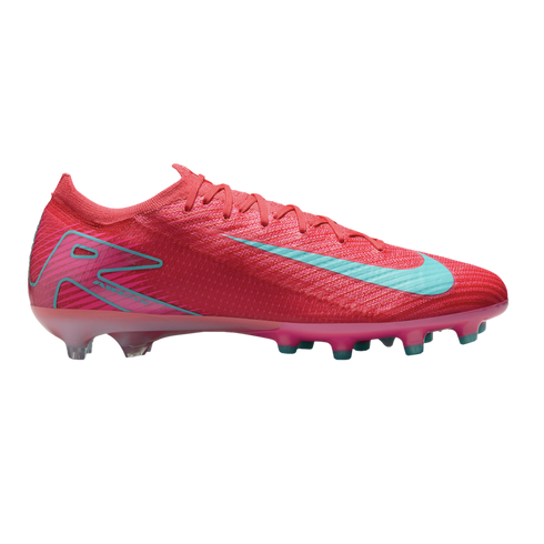 Side profile of a vibrant pink Nike soccer cleat featuring a light blue swoosh and "AIR ZOOM" branding on the heel.