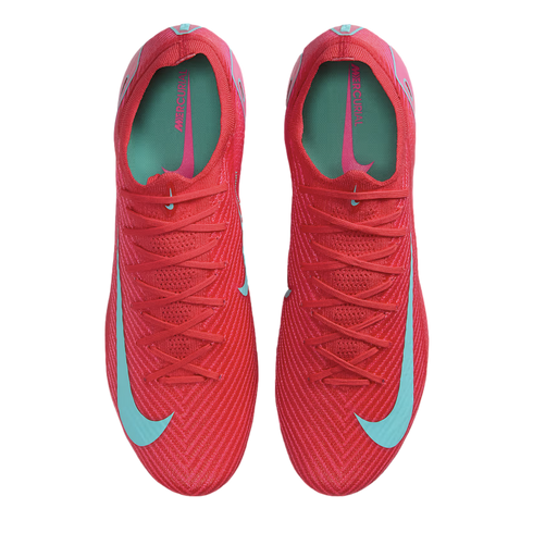 Top-down view of a pair of bright red Nike Mercurial soccer cleats with light blue swooshes and teal insoles, set against a black background.