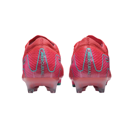 Rear view of two bright pink Nike Mercurial soccer cleats with light blue accents and "MERCURIAL" printed on the heels, against a black background.