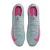 Top-down view of light blue Nike Mercurial soccer cleats with bright pink accents on a black background.