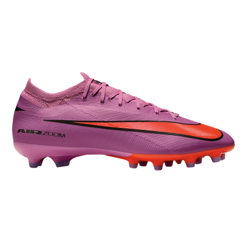 A purple Nike Air Zoom Mercurial soccer cleat with a large bright orange swoosh and matching studs, shown in profile against a black background.