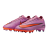 A pair of pink Nike Air Zoom soccer cleats with bright orange accents on the sole and logo, isolated on a black background.