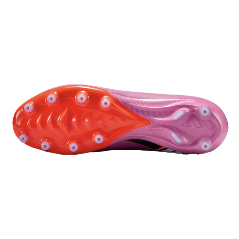 The underside of a Nike soccer cleat featuring a bright orange forefoot and purple heel with light blue circular studs, shown against a solid black background.