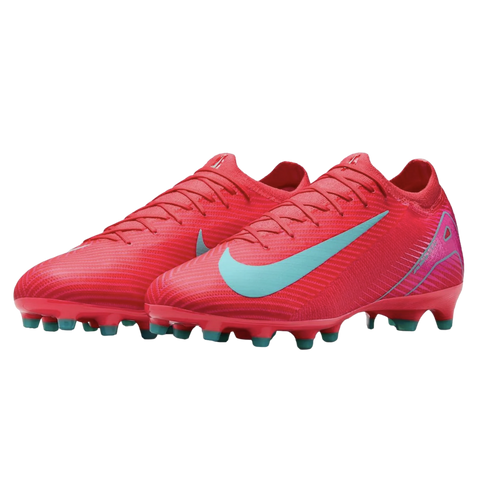 A pair of bright red Nike soccer cleats with light blue swooshes and red-studded soles.