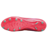 Bottom view of a pink soccer cleat showing the soleplate with light green studs and intricate molded patterns against a solid black background.